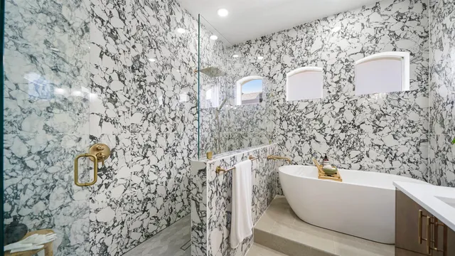 a bathroom with a bathtub and sink