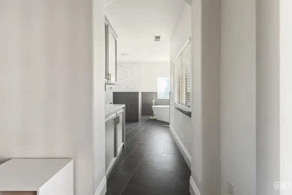 a view of a bathroom with a sink and a washer