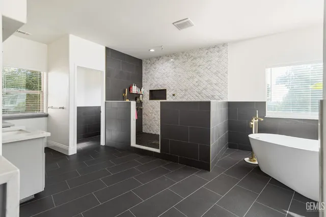 a bathroom with a bathtub and a sink