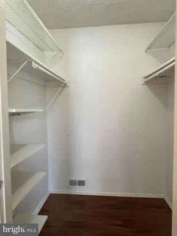 a view of an empty walk in closet