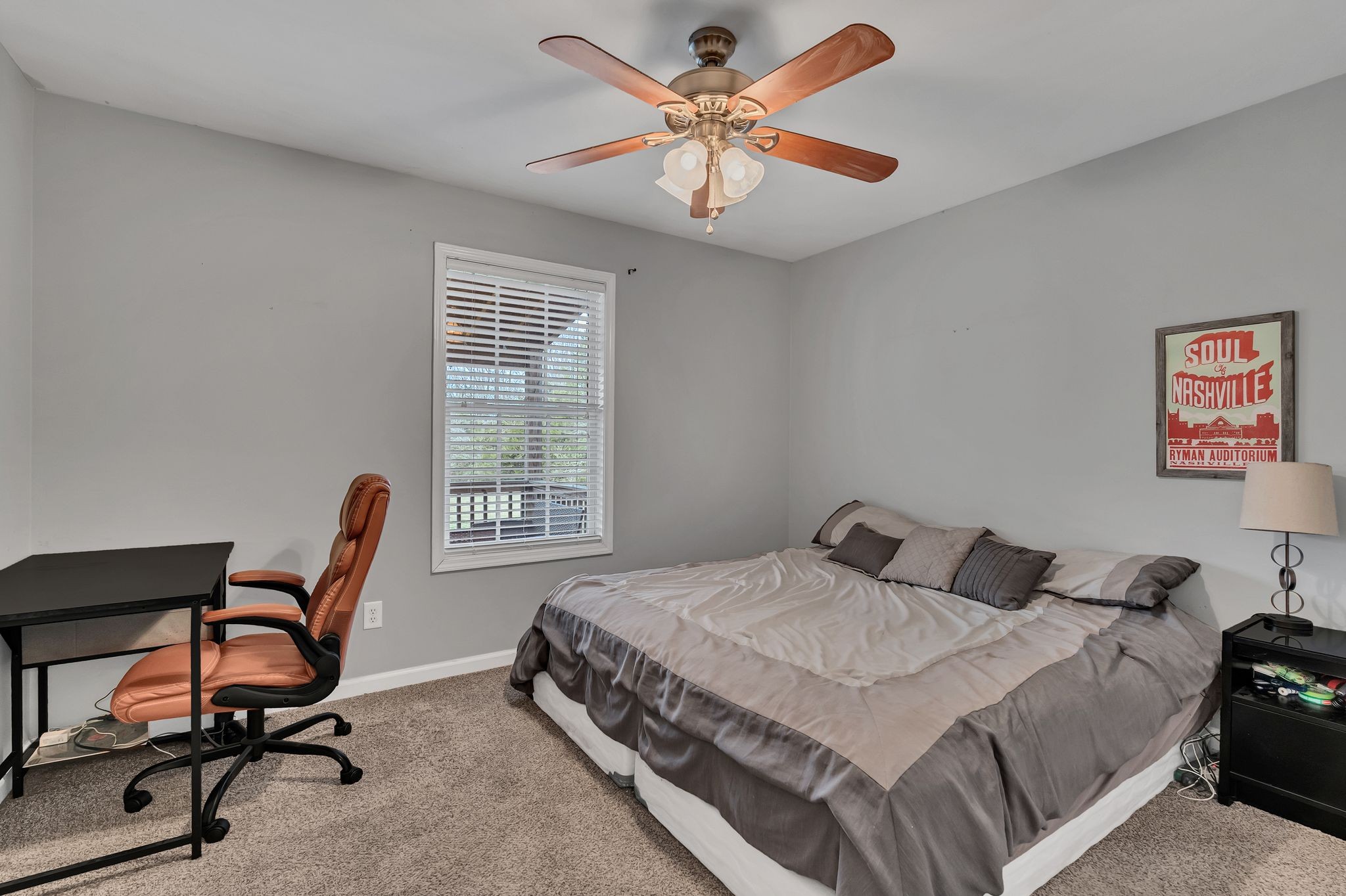 4237 Kedron Road Spring Hill, TN 37174 - Photo 20 of 48 a bedroom with a bed a desk and chair next to a window