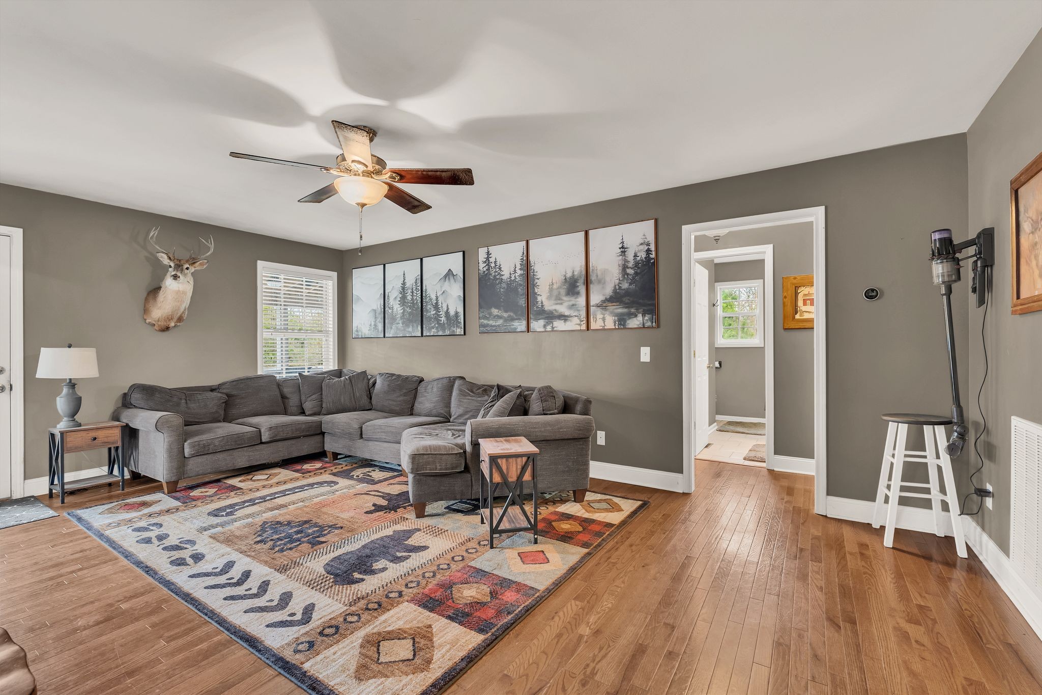 4237 Kedron Road Spring Hill, TN 37174 - Photo 9 of 48 a living room with furniture and wooden floor
