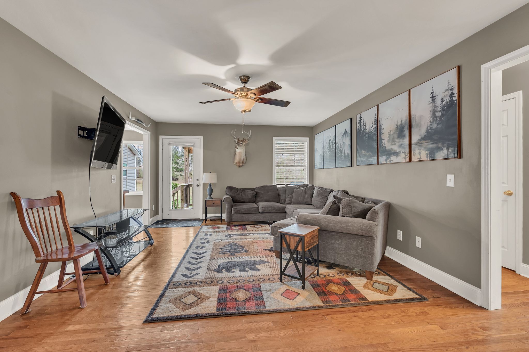 4237 Kedron Road Spring Hill, TN 37174 - Photo 10 of 48 a living room with furniture a flat screen tv and a window