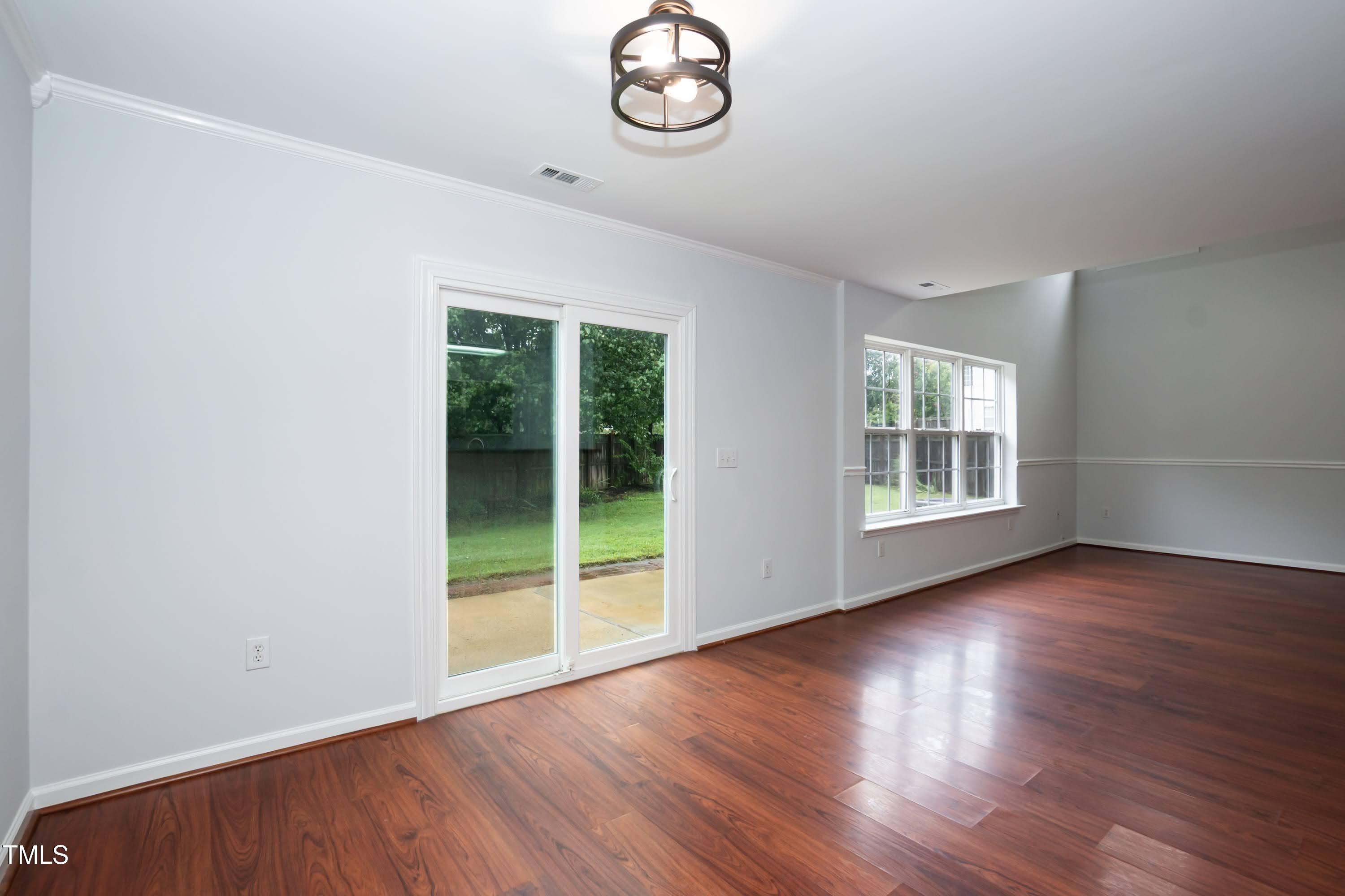 8 Kingfisher Way Durham, NC 27713 - Photo 12 of 25 an empty room with wooden floor and window
