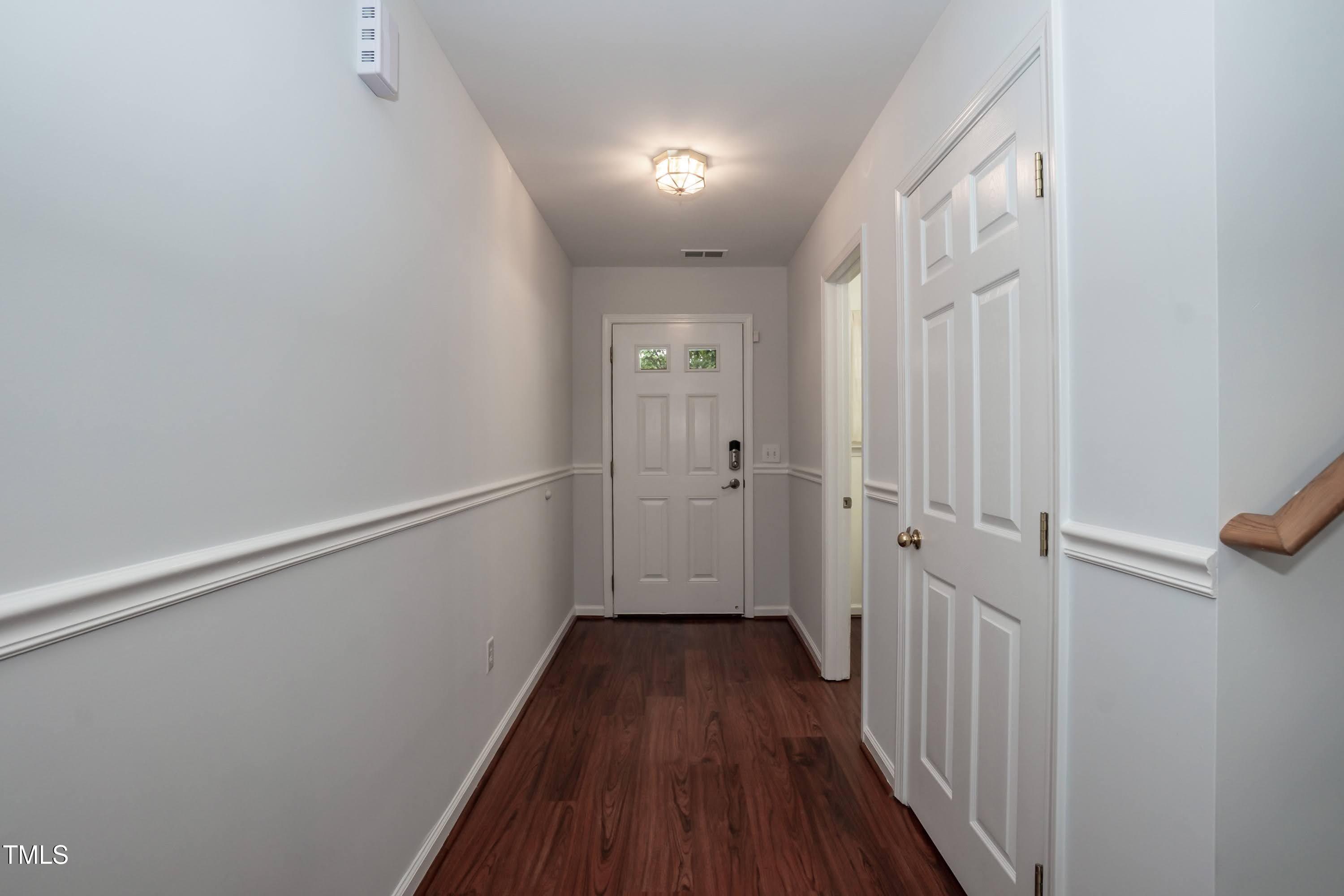 8 Kingfisher Way Durham, NC 27713 - Photo 3 of 25 a view of a hallway with wooden floor