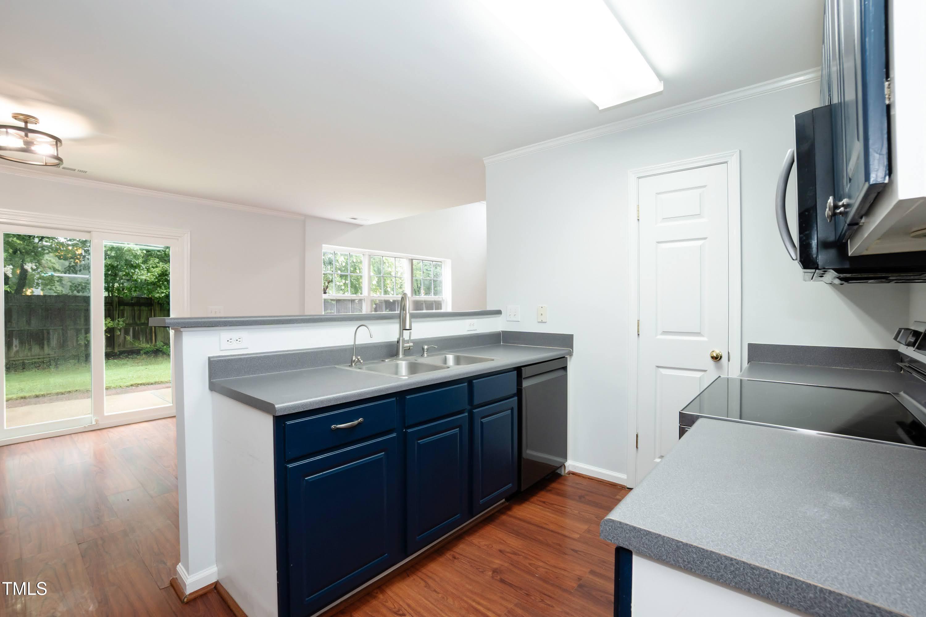 8 Kingfisher Way Durham, NC 27713 - Photo 9 of 25 a kitchen with a sink and a stove top oven