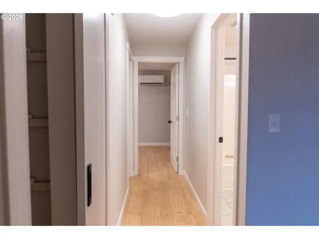 a view of a bathroom from a hallway