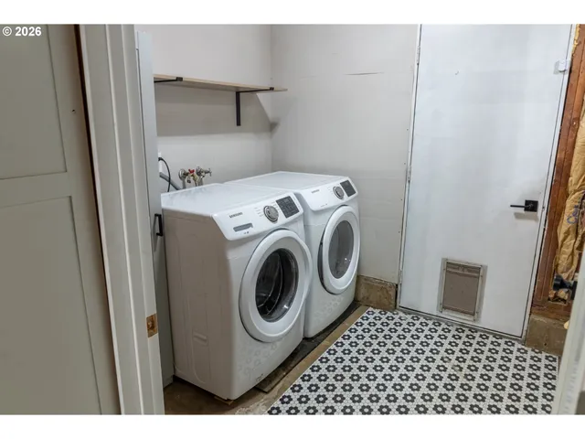 a utility room with dryer and washer
