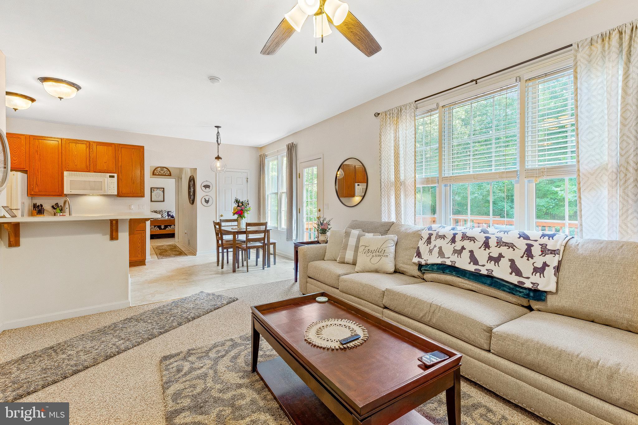 5270 Mackall Road St. Leonard, MD 20685 - Photo 13 of 42 a living room with furniture and a large window