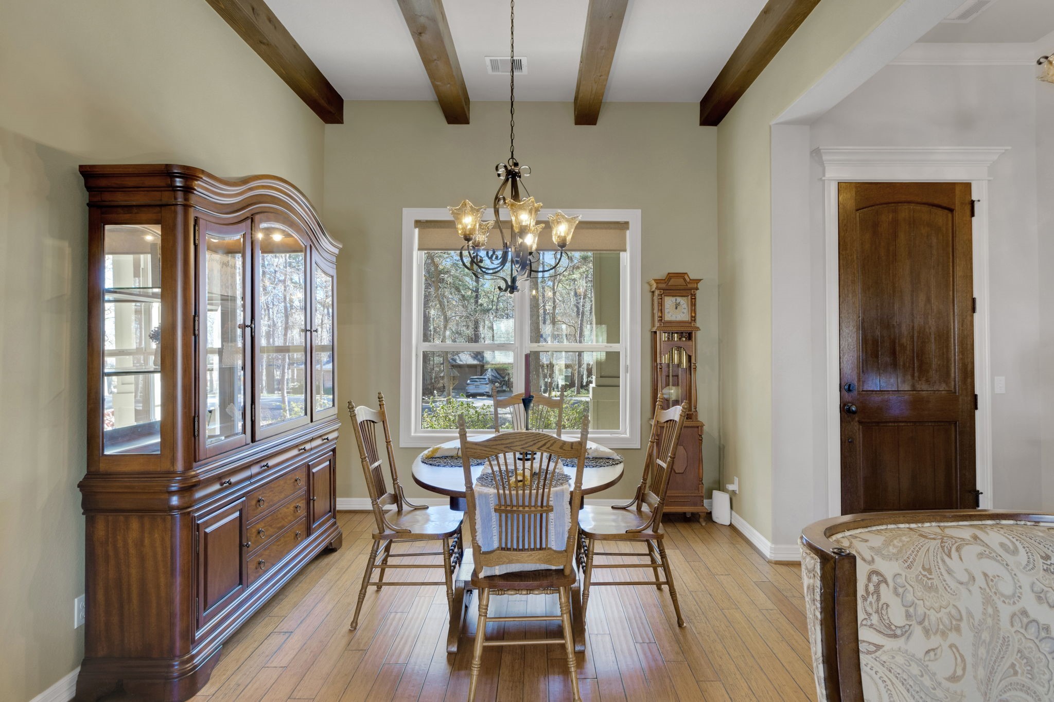 1040 Kings Way Coldspring, TX 77331 - Photo 12 of 50 The dining room is highlighted by beautiful wood beams and offers charming views of the front yard