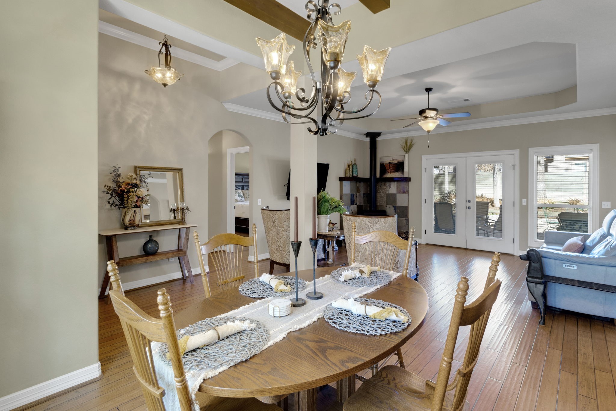 1040 Kings Way Coldspring, TX 77331 - Photo 16 of 50 Custom light fixtures throughout the home. These fixtures add a unique and stylish touch, perfectly complementing the overall design and creating a warm, inviting atmosphere.