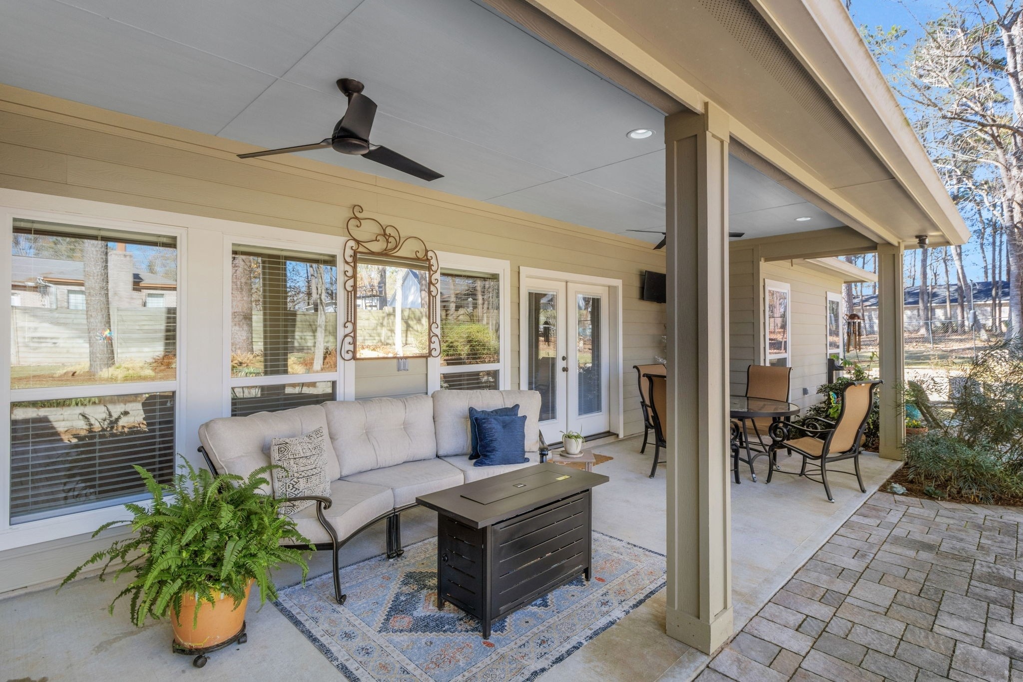 1040 Kings Way Coldspring, TX 77331 - Photo 18 of 50 A shaded patio setup designed for easy indoor-outdoor living