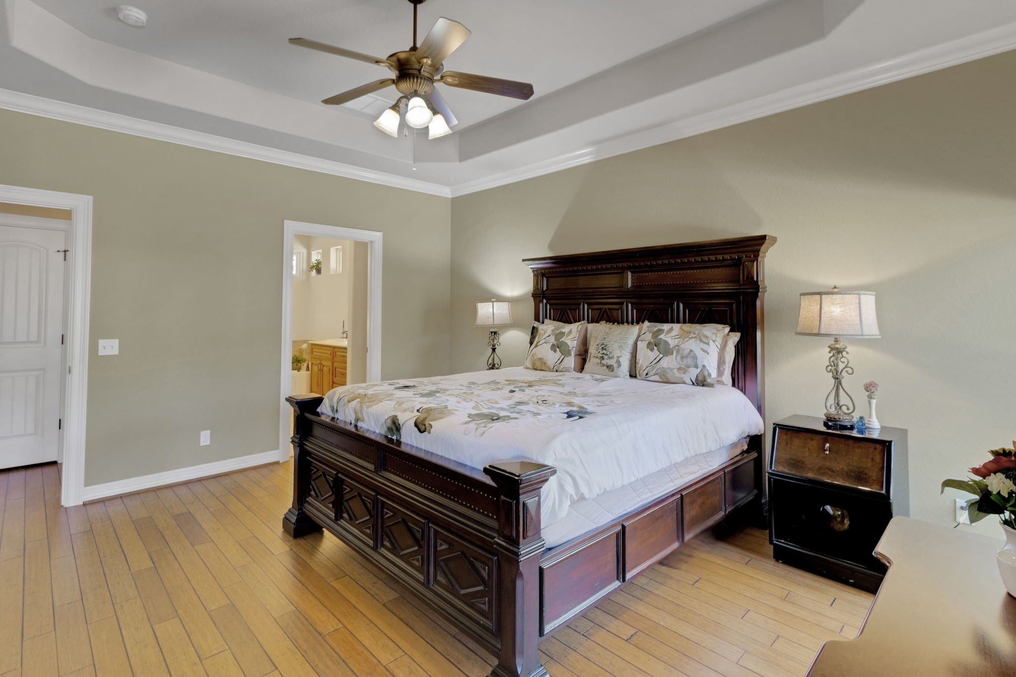 1040 Kings Way Coldspring, TX 77331 - Photo 29 of 50 a spacious bedroom with a bed and a chandelier