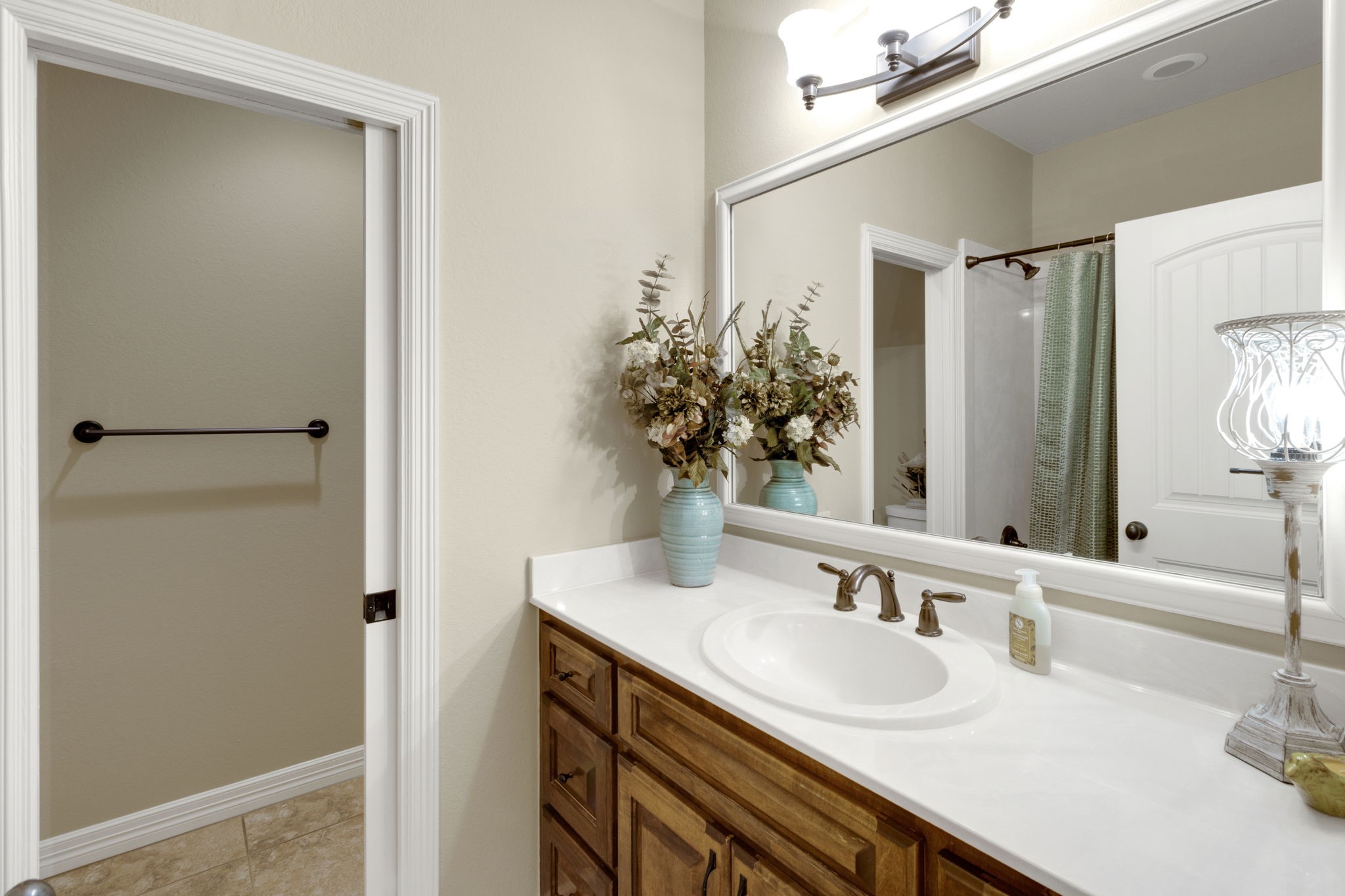 1040 Kings Way Coldspring, TX 77331 - Photo 37 of 50 a bathroom with a sink and a mirror