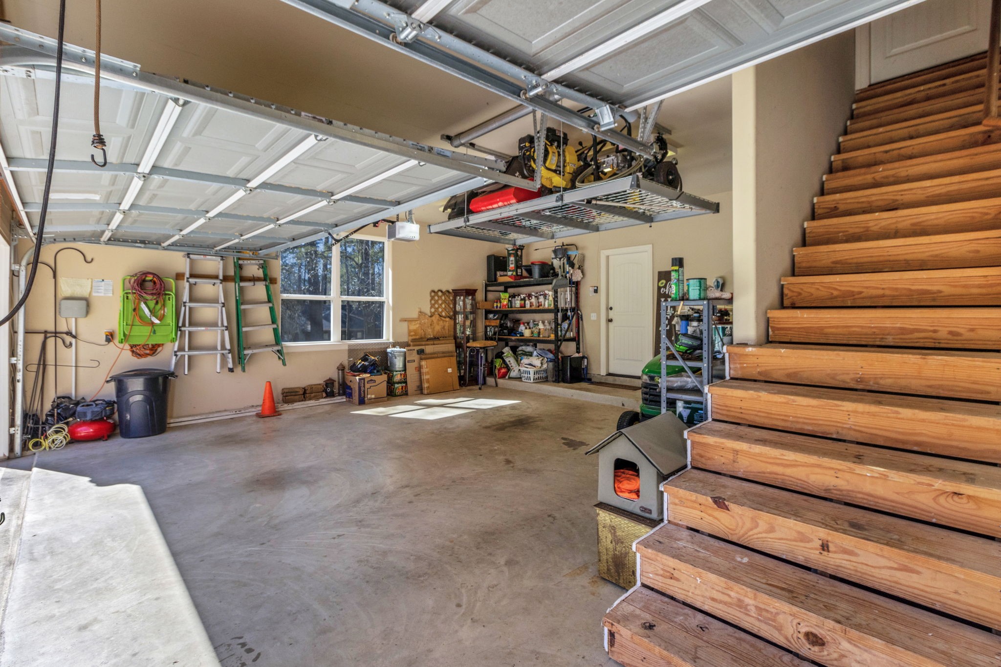 1040 Kings Way Coldspring, TX 77331 - Photo 41 of 50 These stairs in the garage lead you up to a decked attic of approximately 300 SF of storage