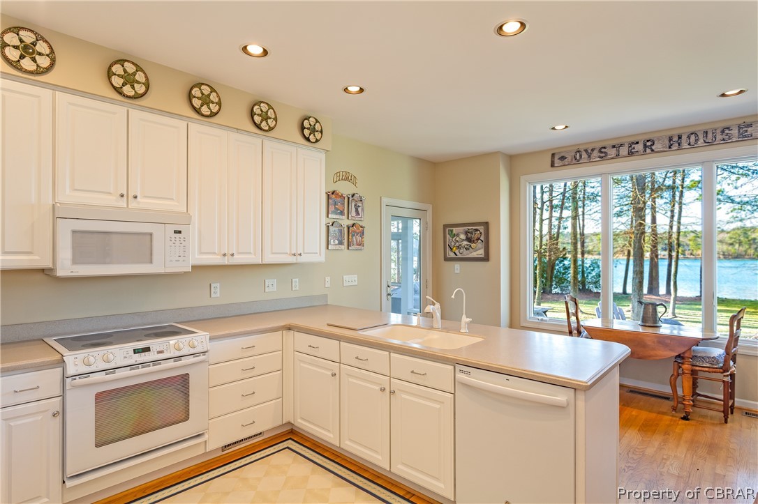 194 Oyster House Road White Stone, VA 22578 - Photo 24 of 50 kitchen with wide water views and breakfast nook