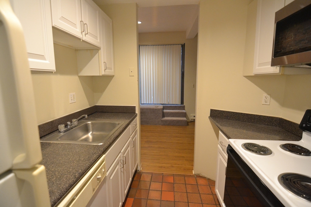 67 St Germain Street, Unit 232 Boston, MA 02115 - Photo 13 of 15 a kitchen with a stove and a sink