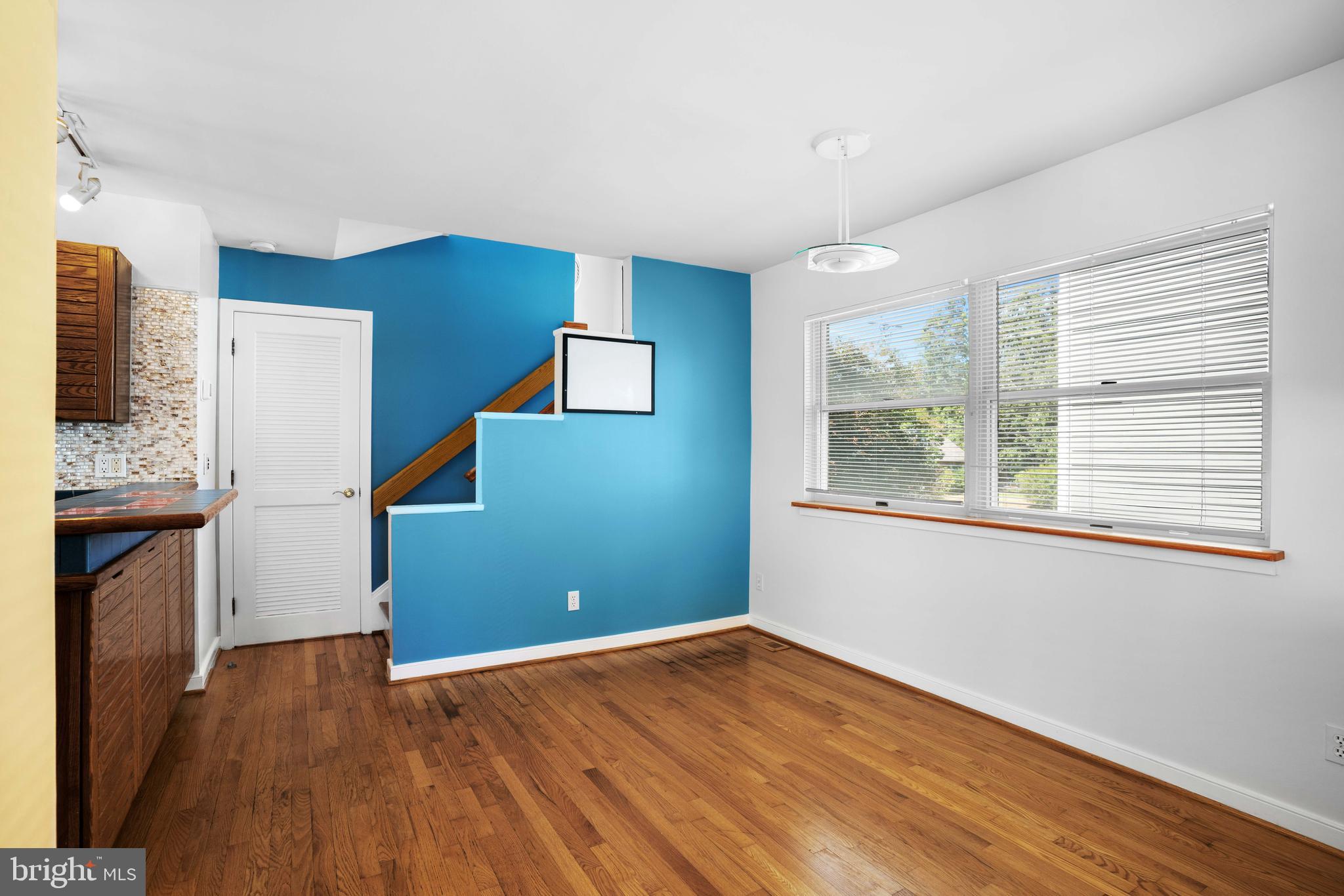 4734 Oak Road Shady Side, MD 20764 - Photo 12 of 48 a view of empty room with wooden floor and fan