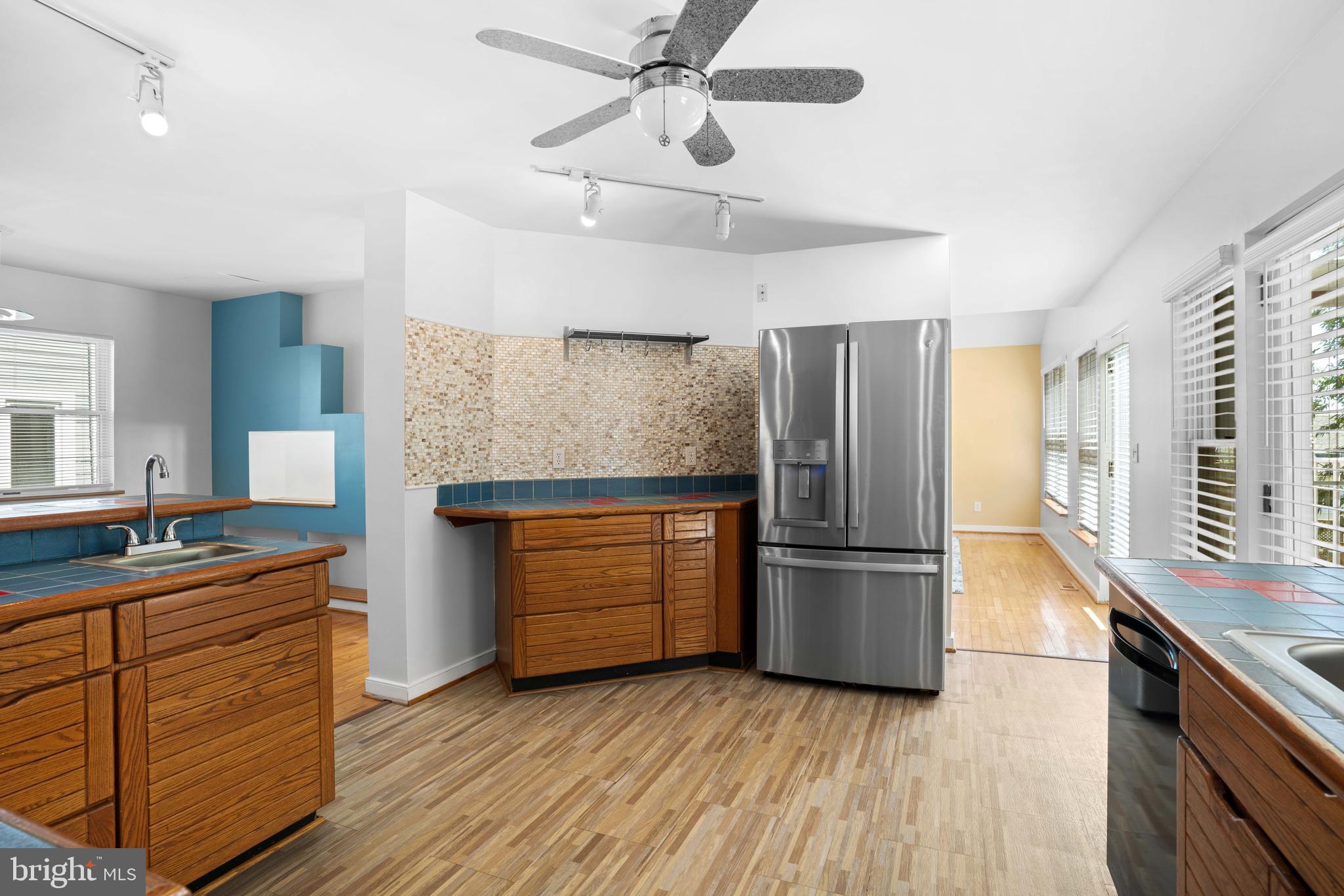 4734 Oak Road Shady Side, MD 20764 - Photo 17 of 48 a kitchen with stainless steel appliances granite countertop a refrigerator a stove and a sink