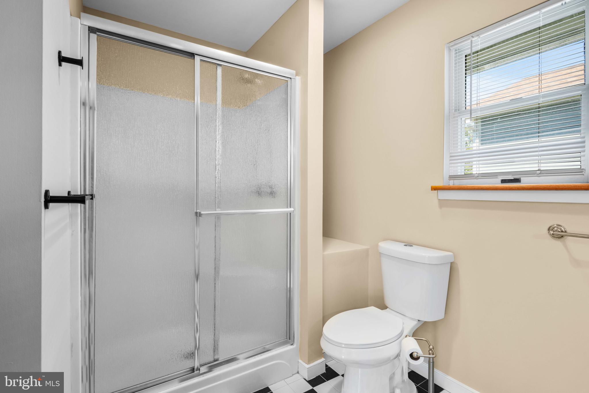 4734 Oak Road Shady Side, MD 20764 - Photo 20 of 48 a white toilet sitting next to a bathroom sink