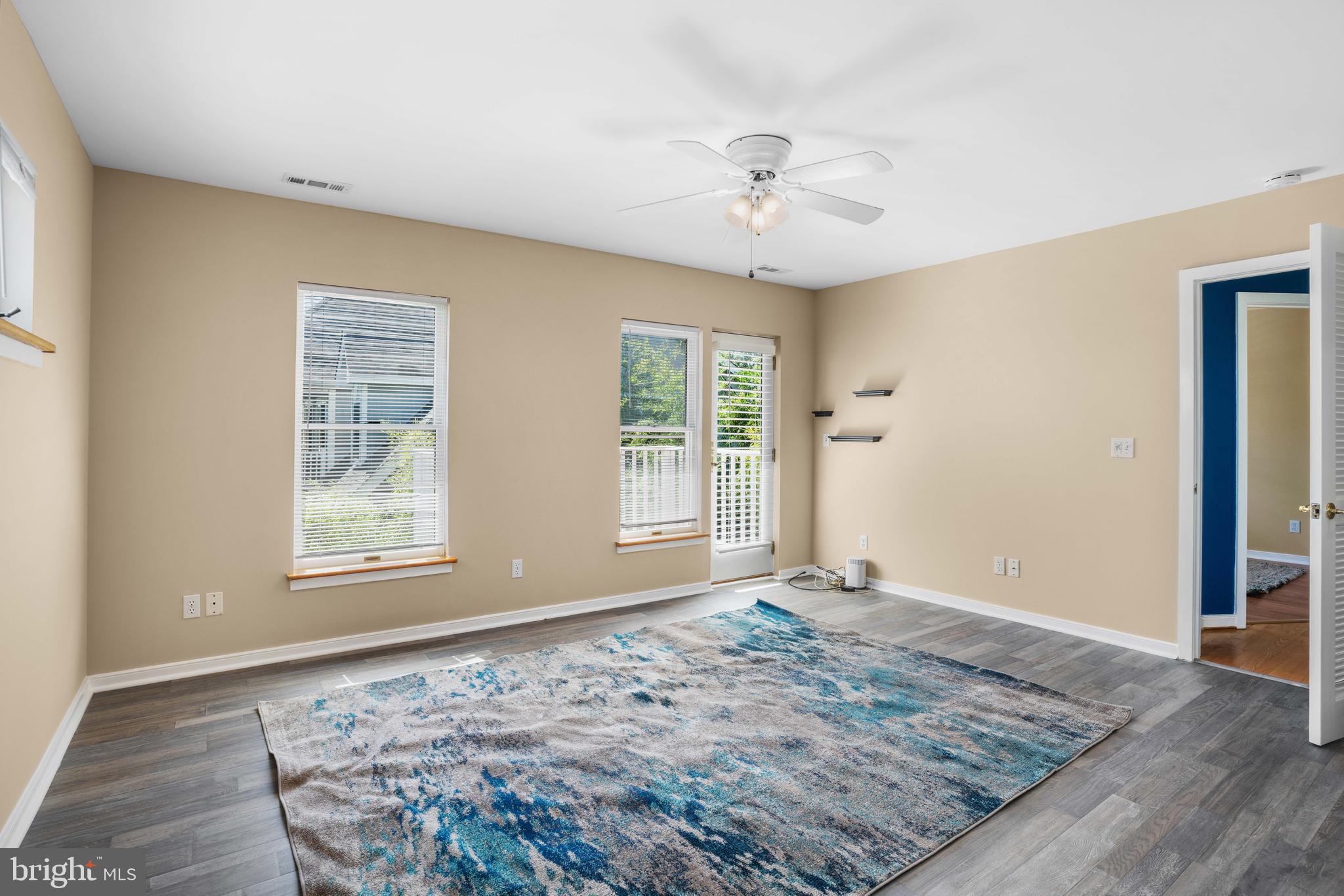 4734 Oak Road Shady Side, MD 20764 - Photo 21 of 48 a view of an empty room with window and wooden floor