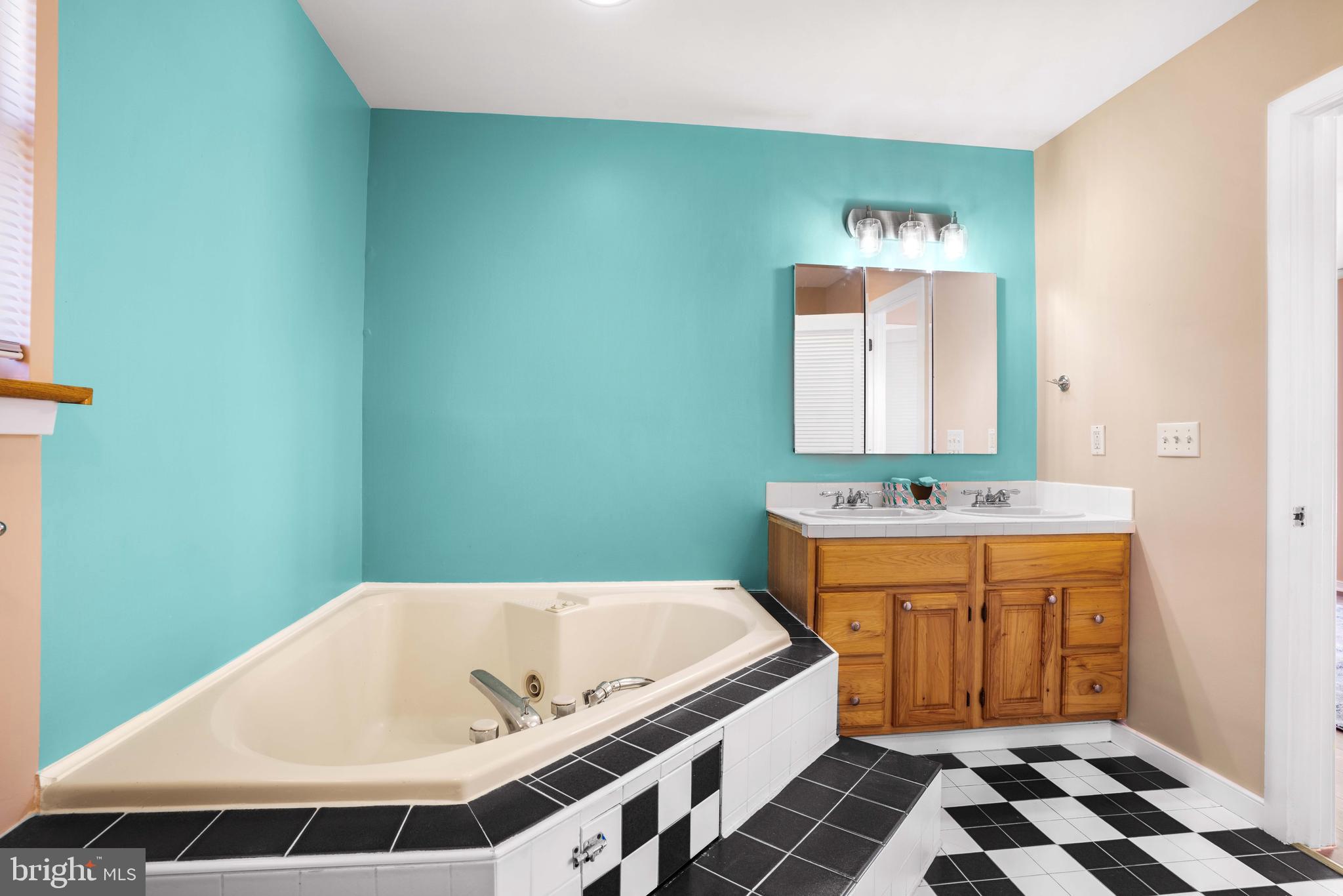 4734 Oak Road Shady Side, MD 20764 - Photo 23 of 48 a bathroom with a bathtub and a sink