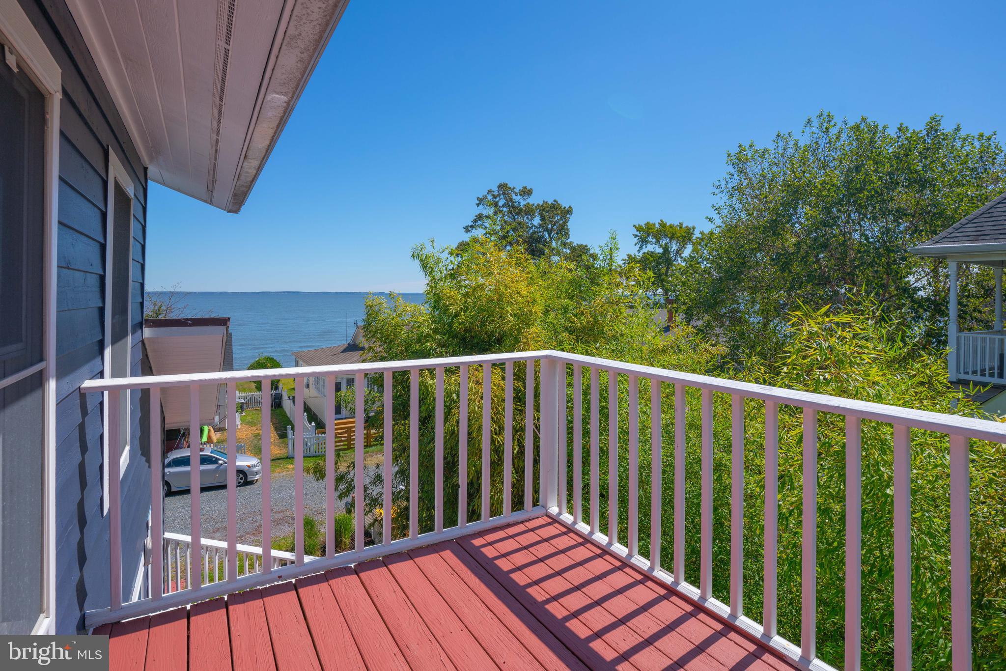 4734 Oak Road Shady Side, MD 20764 - Photo 27 of 48 a balcony with wooden floor and fence
