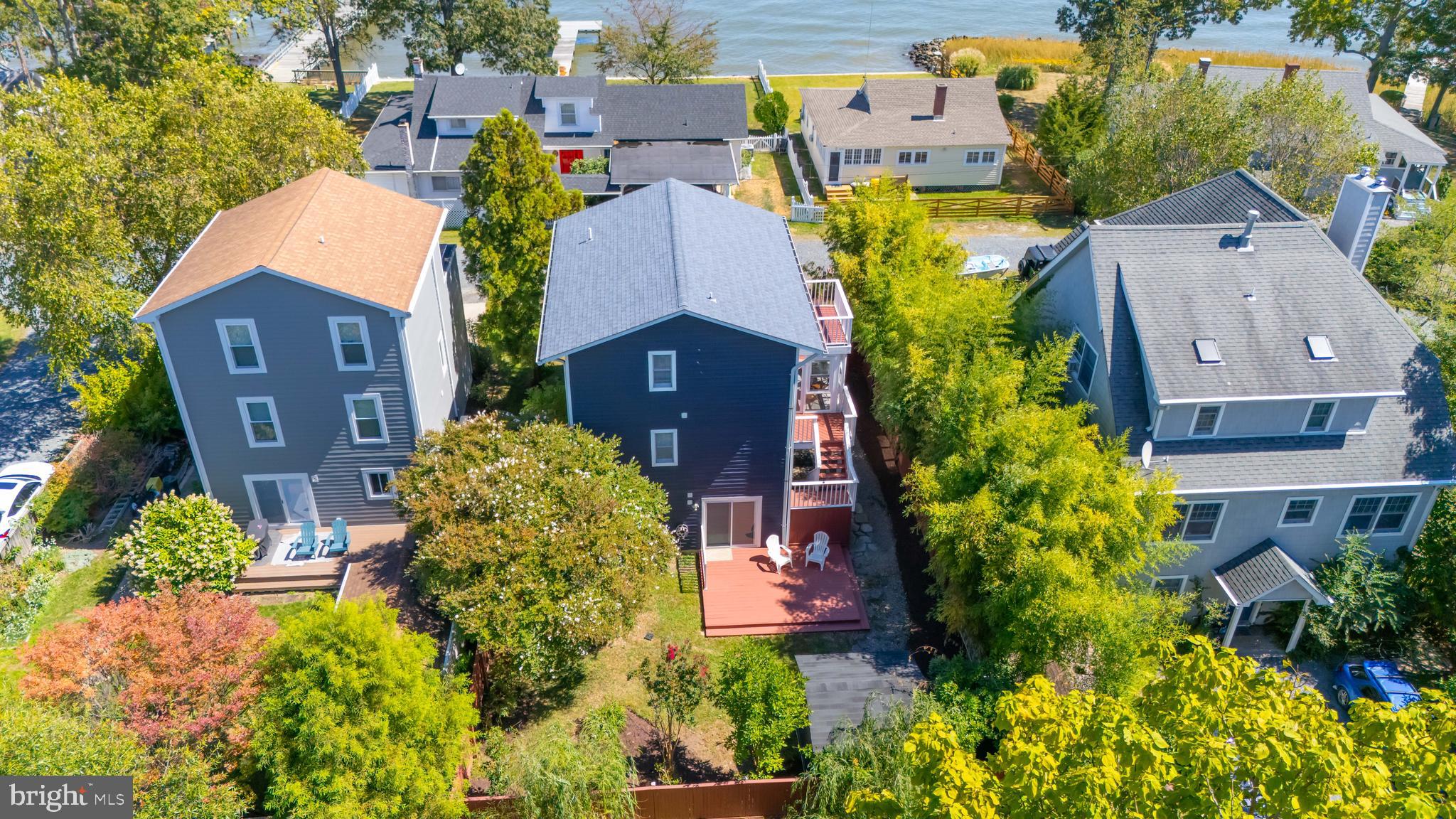 4734 Oak Road Shady Side, MD 20764 - Photo 3 of 48 an aerial view of a house with a swimming pool and garden view