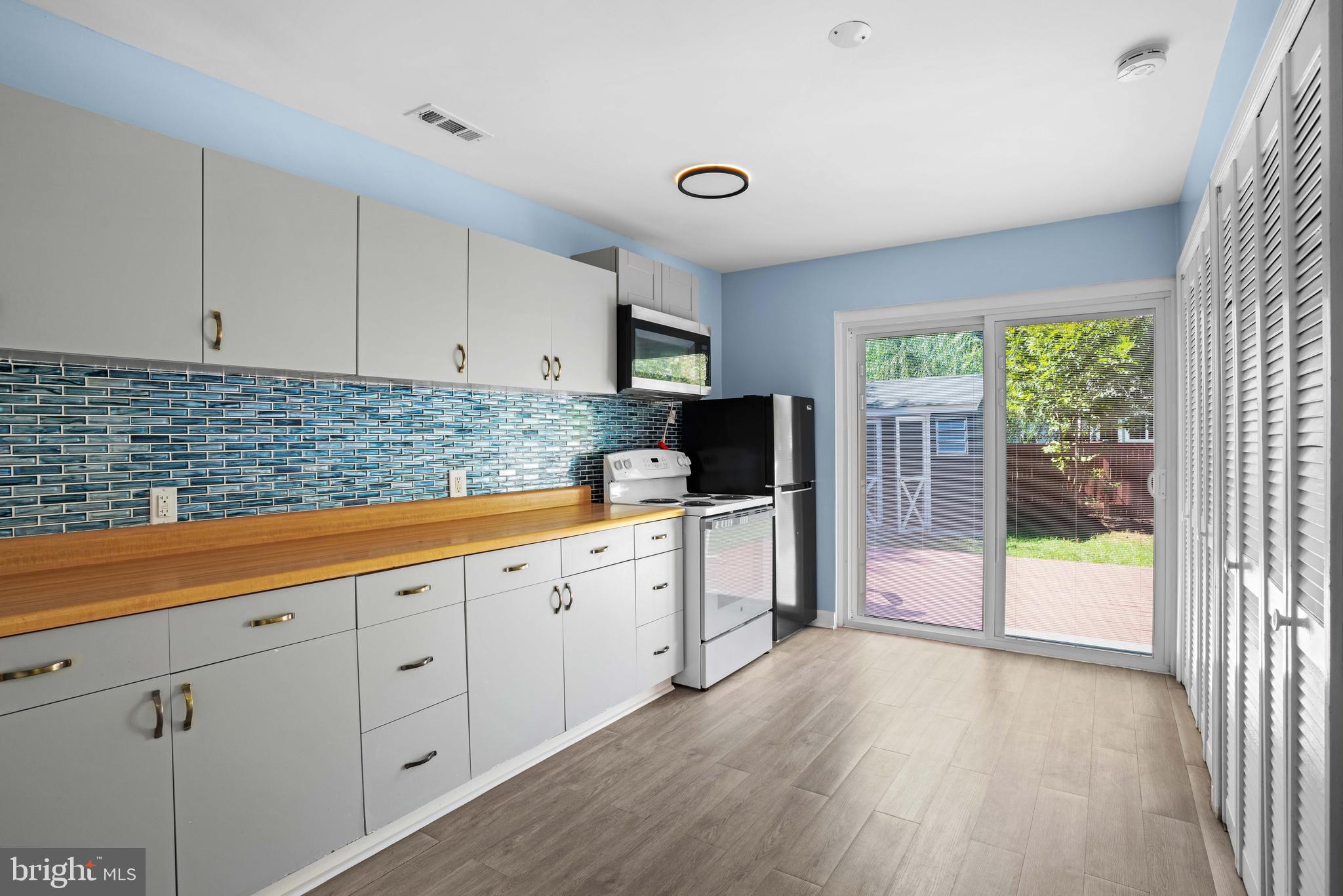 4734 Oak Road Shady Side, MD 20764 - Photo 35 of 48 a kitchen with sink a cabinets and window