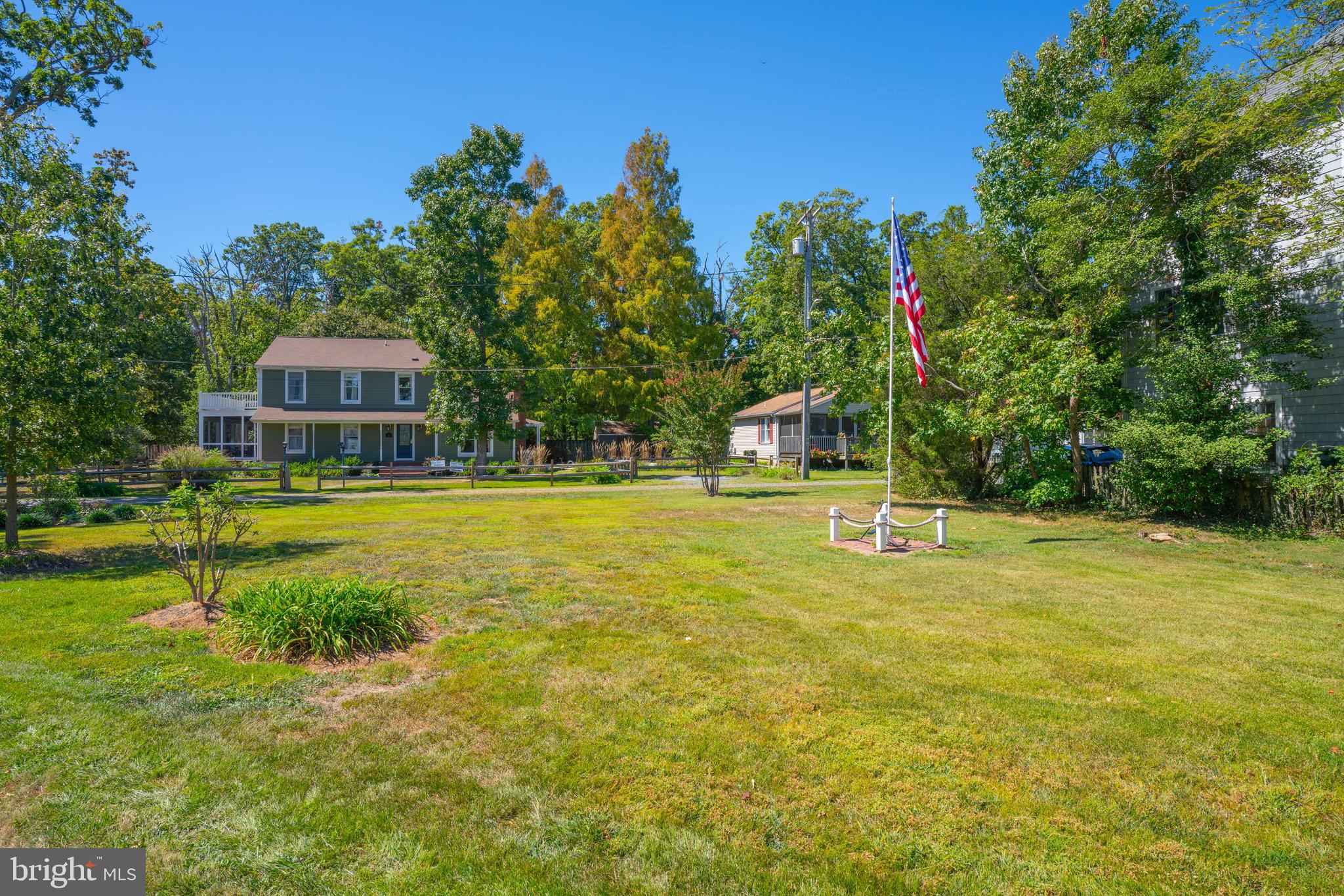 4734 Oak Road Shady Side, MD 20764 - Photo 44 of 48 a house view with swimming pool and trees in the background