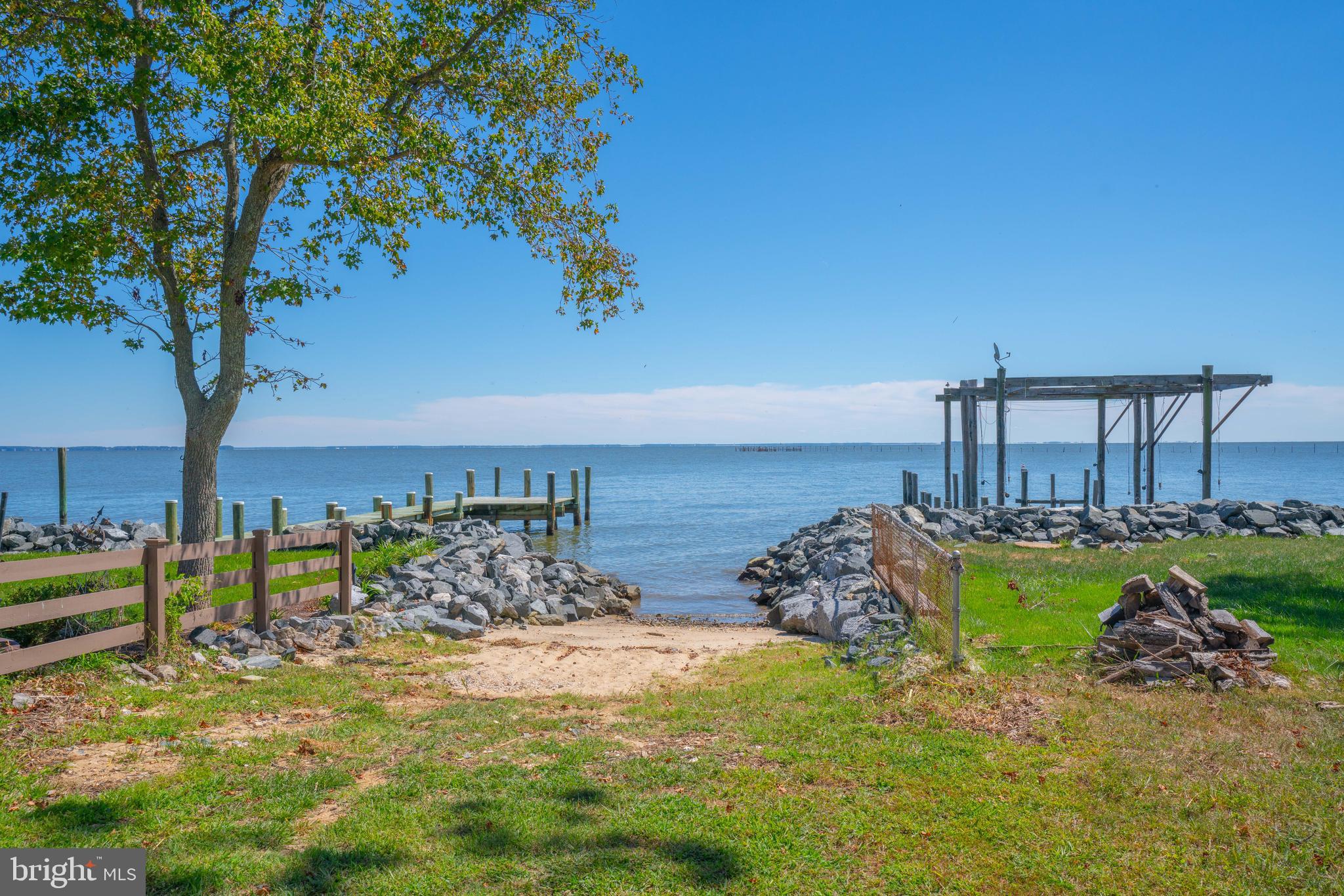 4734 Oak Road Shady Side, MD 20764 - Photo 48 of 48 a view of a backyard with table and chairs potted plants