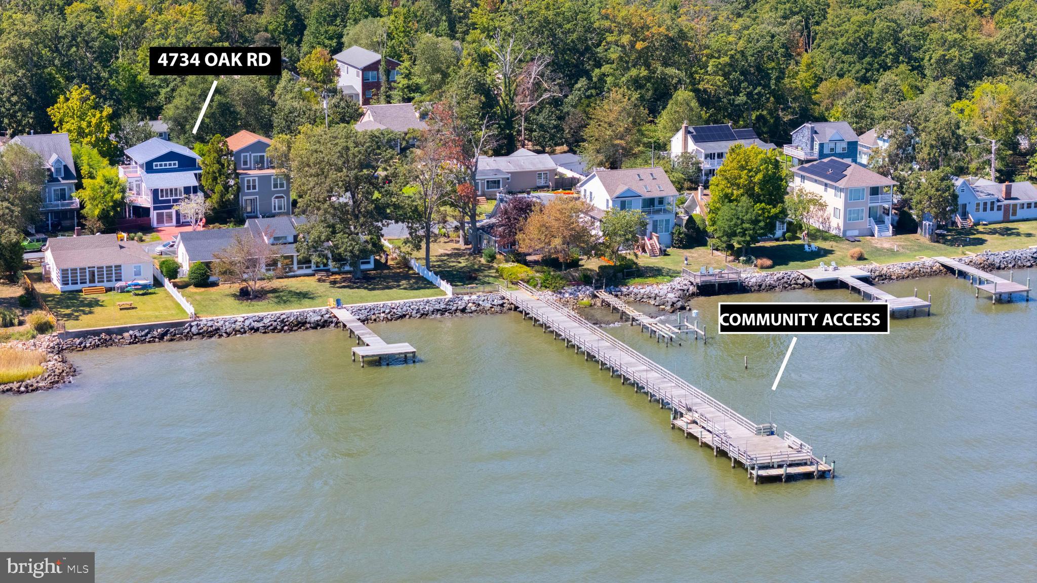 4734 Oak Road Shady Side, MD 20764 - Photo 5 of 48 a view of swimming pool with outdoor seating and a garden