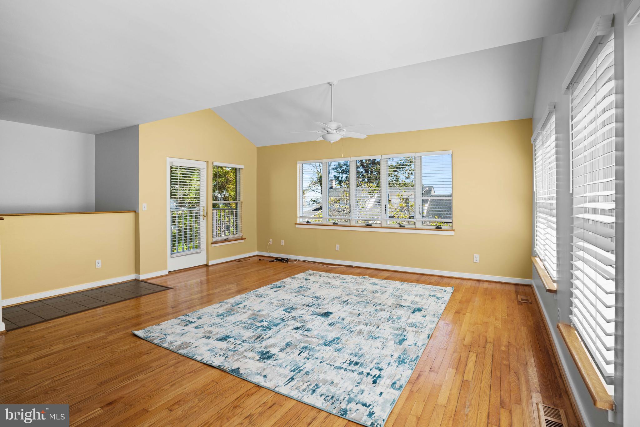 4734 Oak Road Shady Side, MD 20764 - Photo 8 of 48 a view of an empty room with wooden floor and a window