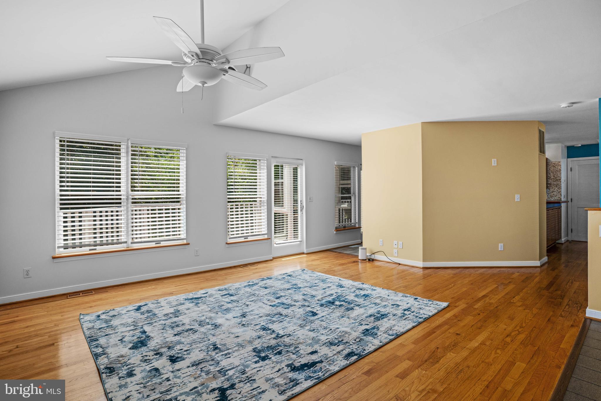 4734 Oak Road Shady Side, MD 20764 - Photo 10 of 48 a view of a livingroom with wooden floor and a ceiling fan
