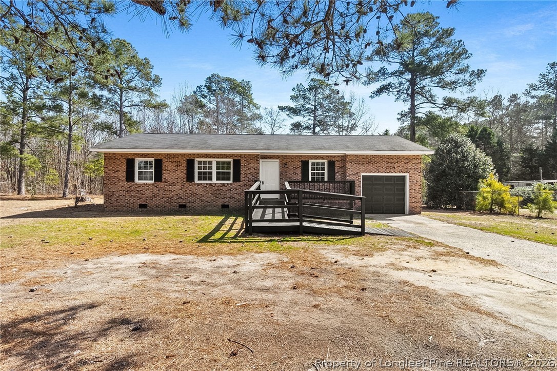 402 Gainey Road Raeford, NC 28376 - Photo 1 of 30 a view of a house with swimming pool and sitting area