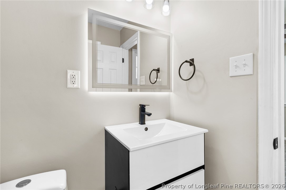 402 Gainey Road Raeford, NC 28376 - Photo 16 of 30 a bathroom with a sink and a mirror