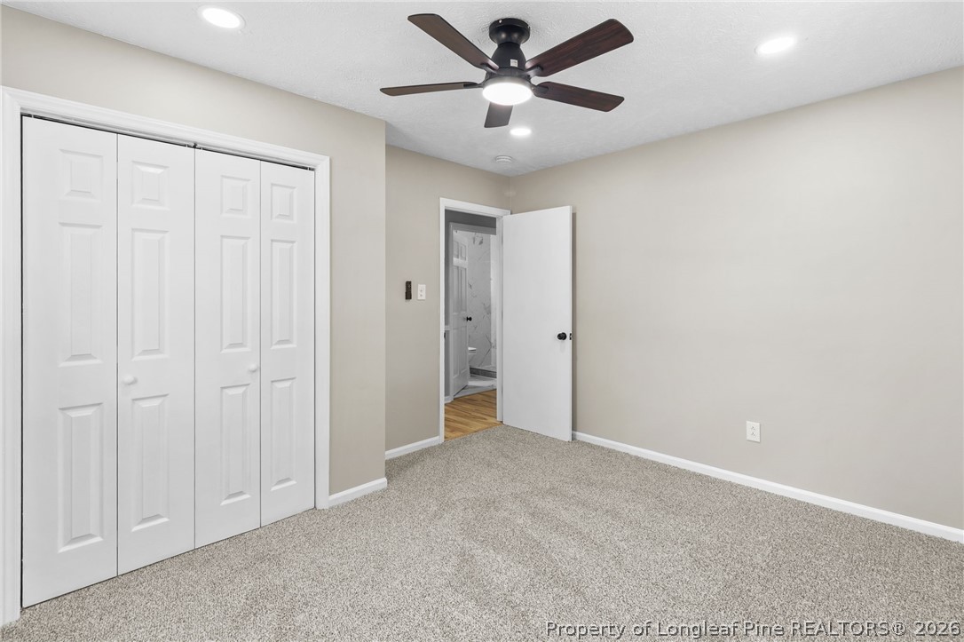 402 Gainey Road Raeford, NC 28376 - Photo 19 of 30 an empty room with a ceiling fan and a window