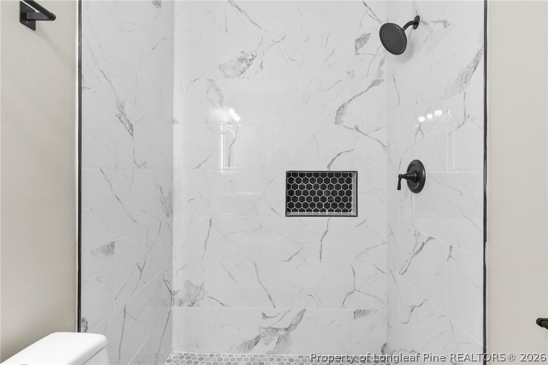 402 Gainey Road Raeford, NC 28376 - Photo 22 of 30 a bathroom with a shower