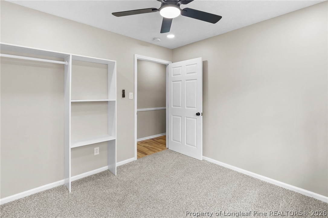 402 Gainey Road Raeford, NC 28376 - Photo 24 of 30 an empty room with closet and windows