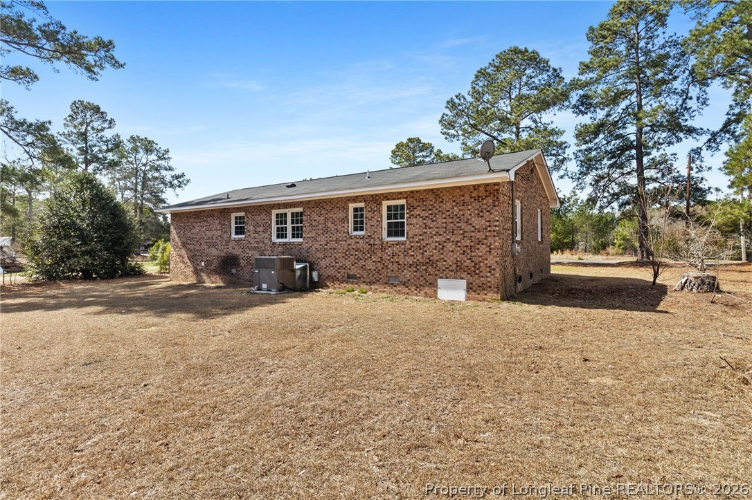 402 Gainey Road Raeford, NC 28376 - Photo 29 of 30 a front view of a house with a yard and garage