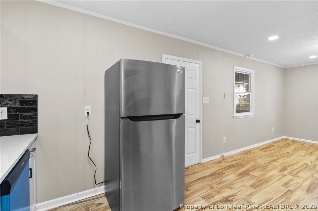 402 Gainey Road Raeford, NC 28376 - Photo 10 of 30 a bathroom with a refrigerator and a window
