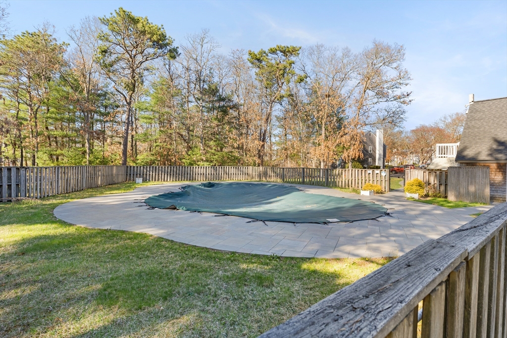 300 Falmouth Road, Unit 20D Mashpee, MA 02649 - Photo 4 of 20 a view of a backyard with large trees