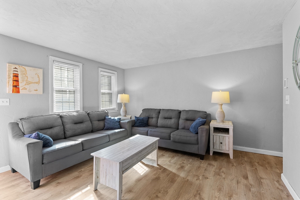 300 Falmouth Road, Unit 20D Mashpee, MA 02649 - Photo 8 of 20 a living room with furniture and a window