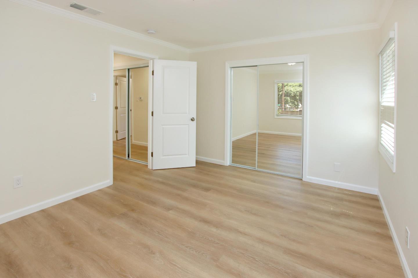 9260 Glen Arbor Road Ben Lomond, CA 95005 - Photo 13 of 33 a view of an empty room with wooden floor and a window