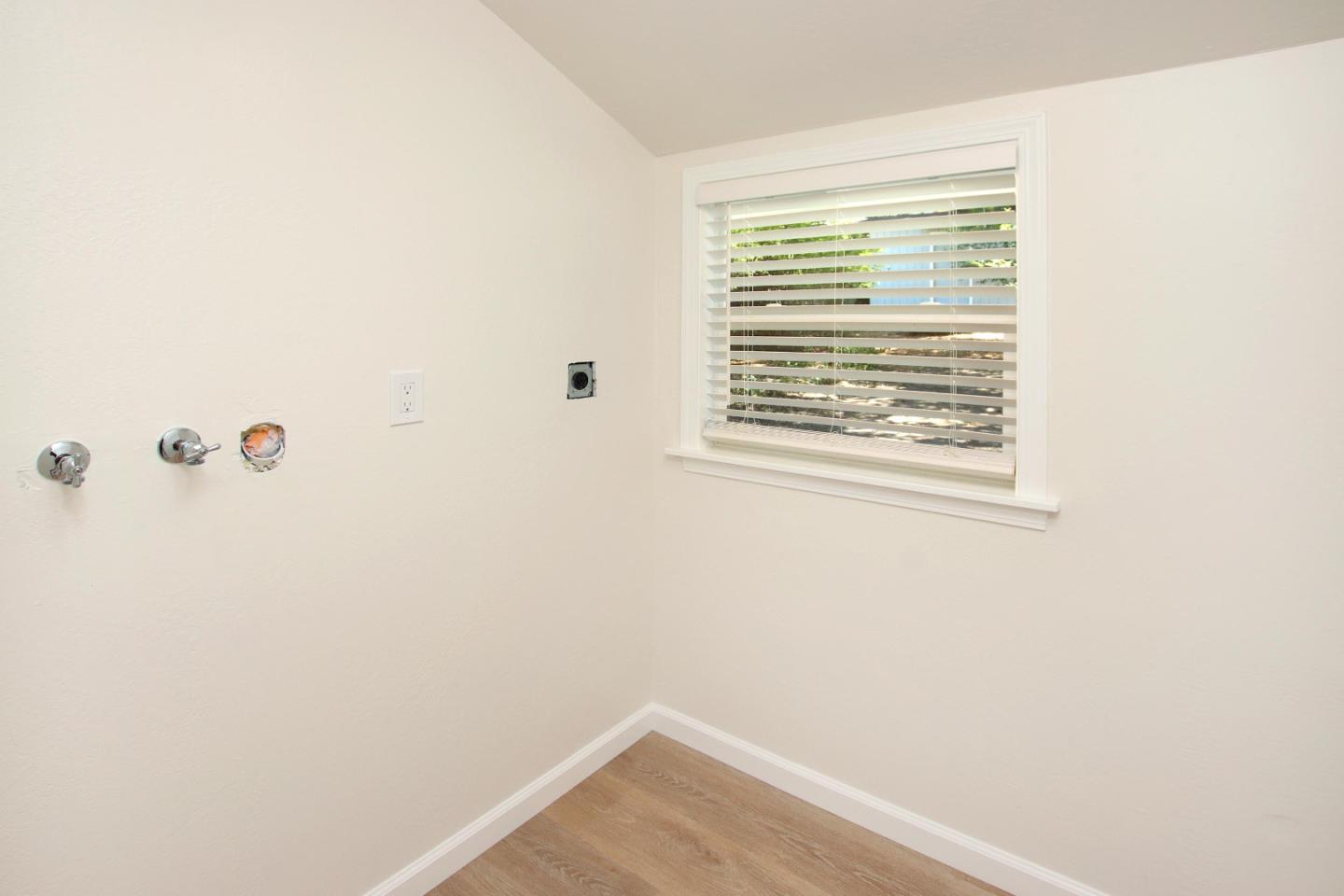 9260 Glen Arbor Road Ben Lomond, CA 95005 - Photo 16 of 33 a view of a small space with wooden floor and a window