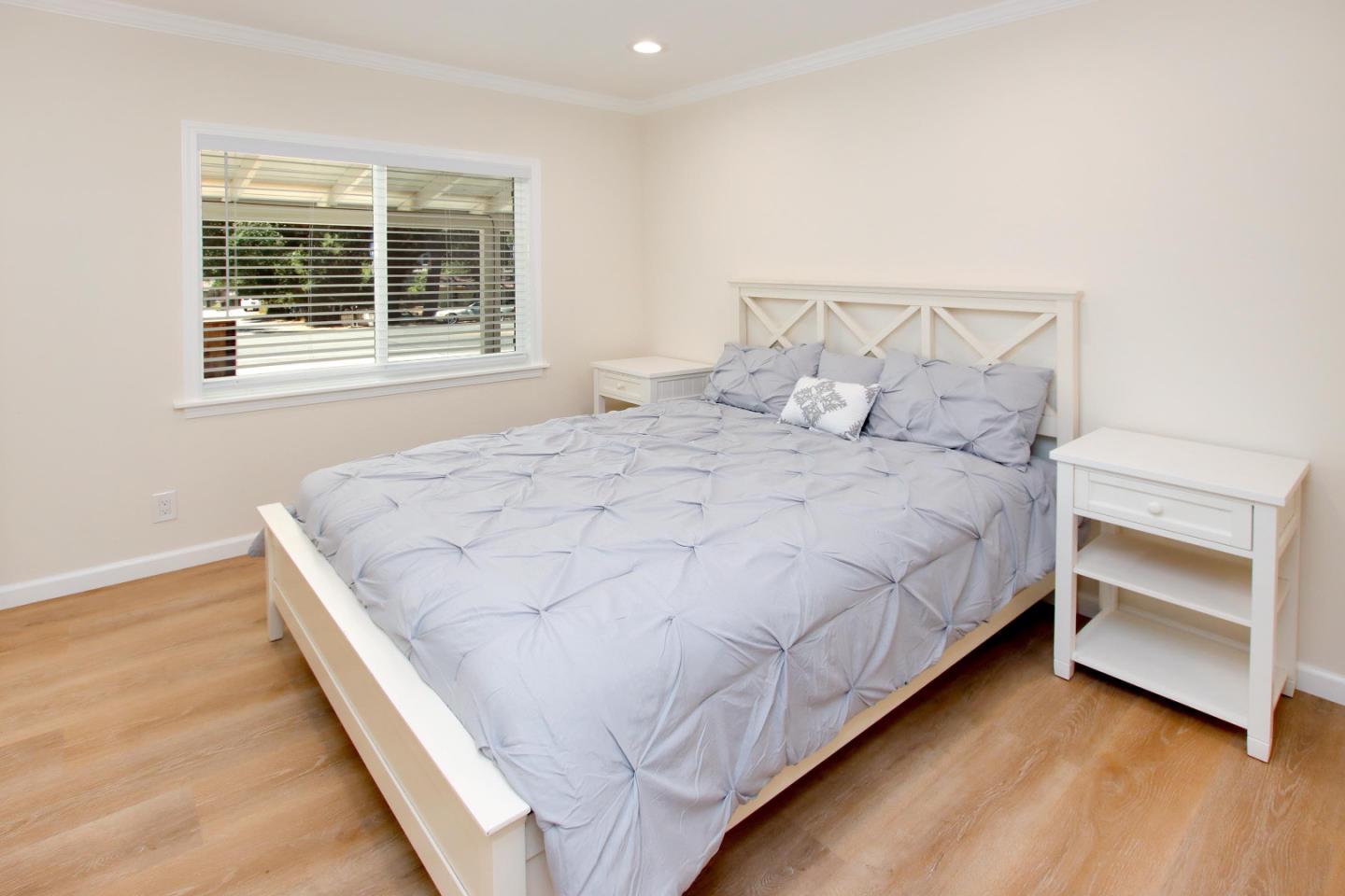 9260 Glen Arbor Road Ben Lomond, CA 95005 - Photo 21 of 33 a large bed sitting in a bedroom next to a window