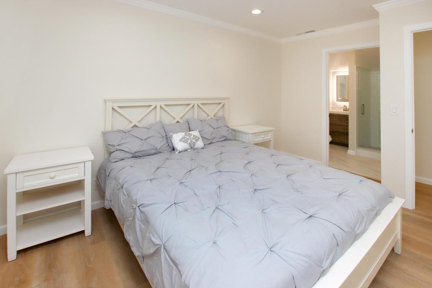 9260 Glen Arbor Road Ben Lomond, CA 95005 - Photo 22 of 33 a large white bed in a white room