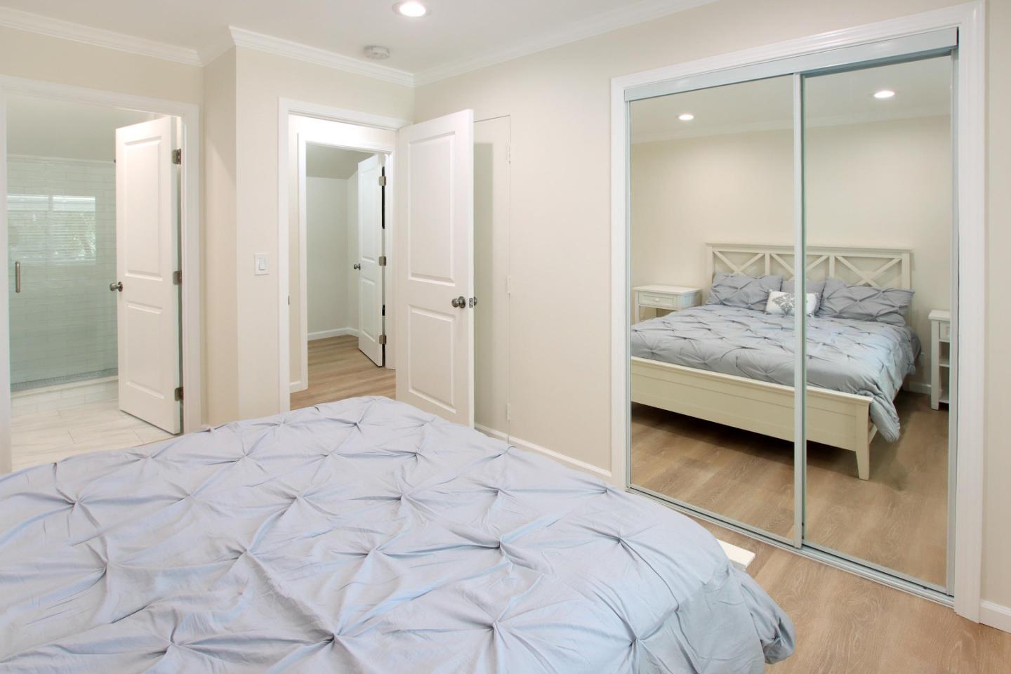 9260 Glen Arbor Road Ben Lomond, CA 95005 - Photo 23 of 33 a bedroom with a bed and large mirror