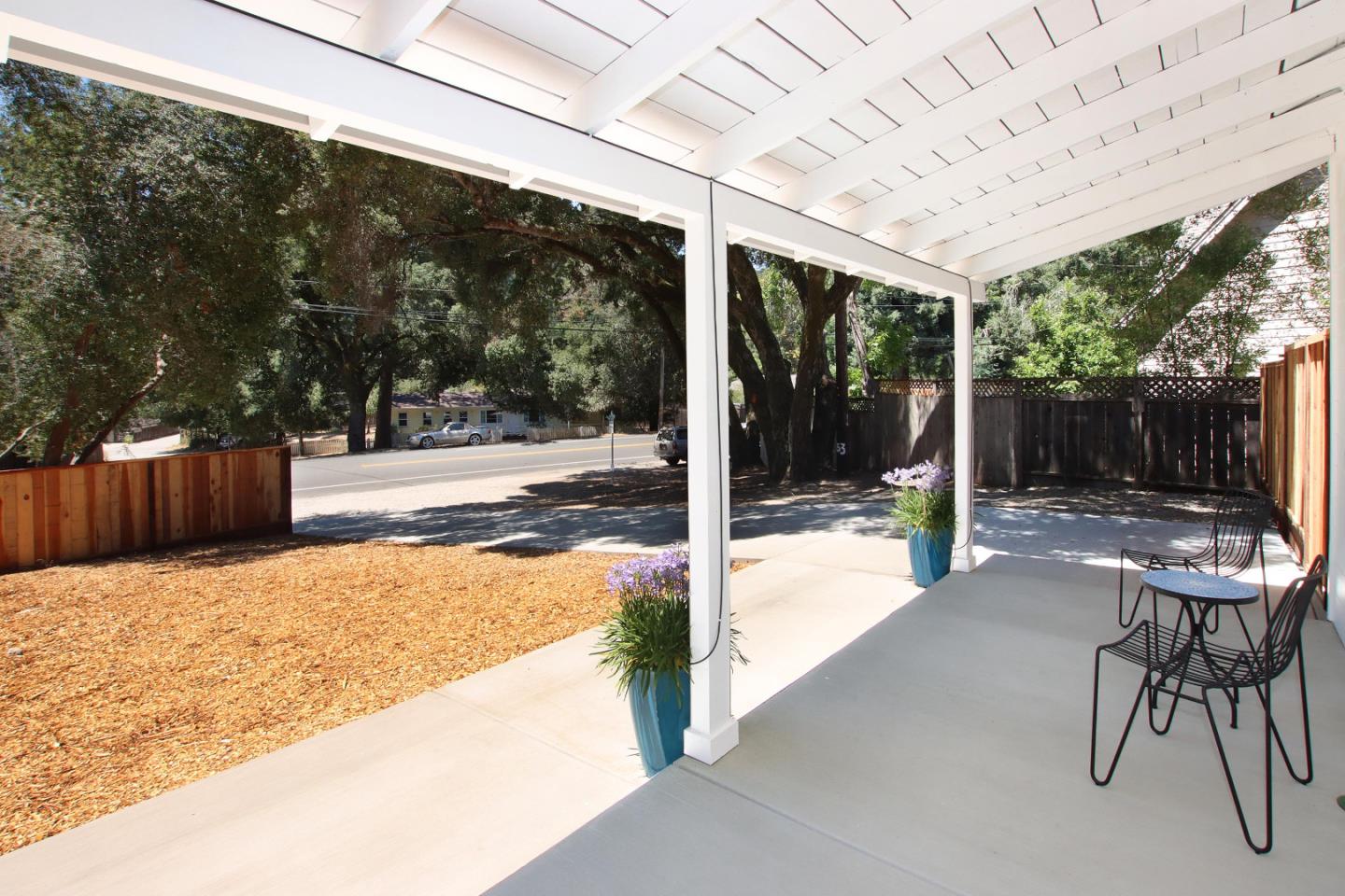 9260 Glen Arbor Road Ben Lomond, CA 95005 - Photo 26 of 33 a view of a patio with a table chairs and a backyard