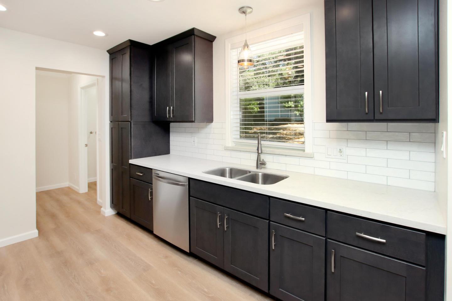 9260 Glen Arbor Road Ben Lomond, CA 95005 - Photo 6 of 33 a kitchen with a sink and wooden cabinets
